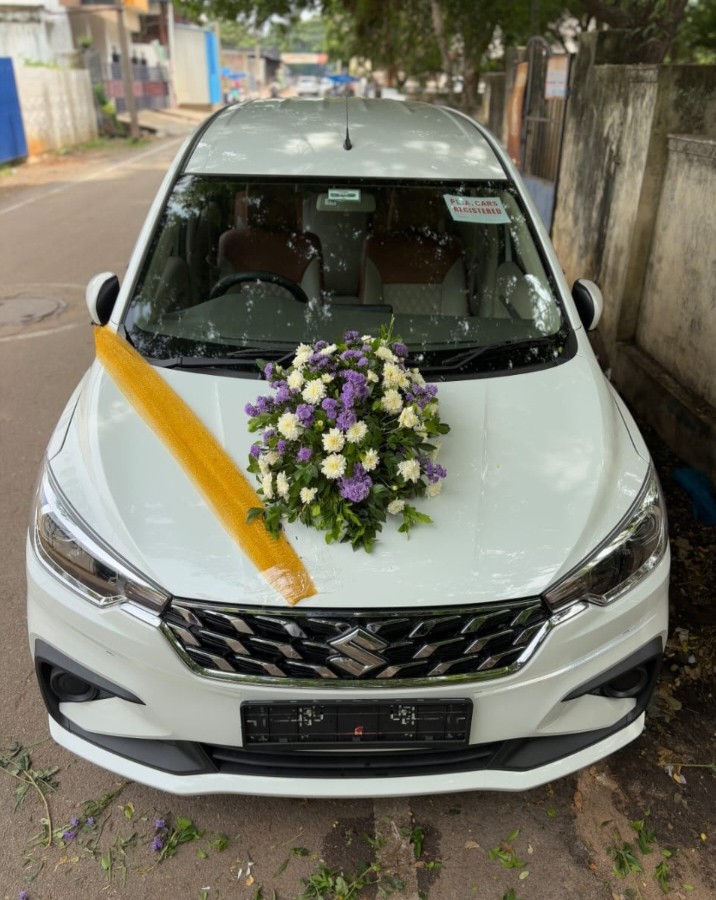 Decorated Maruti Ertiga wedding car with flowers