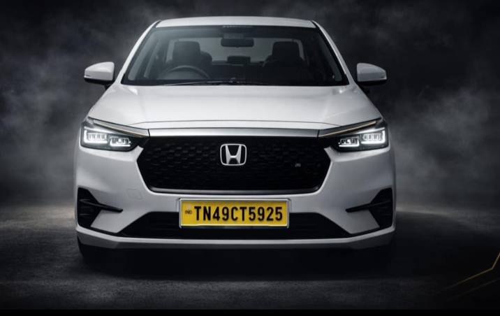 White Honda City sedan for executive travel