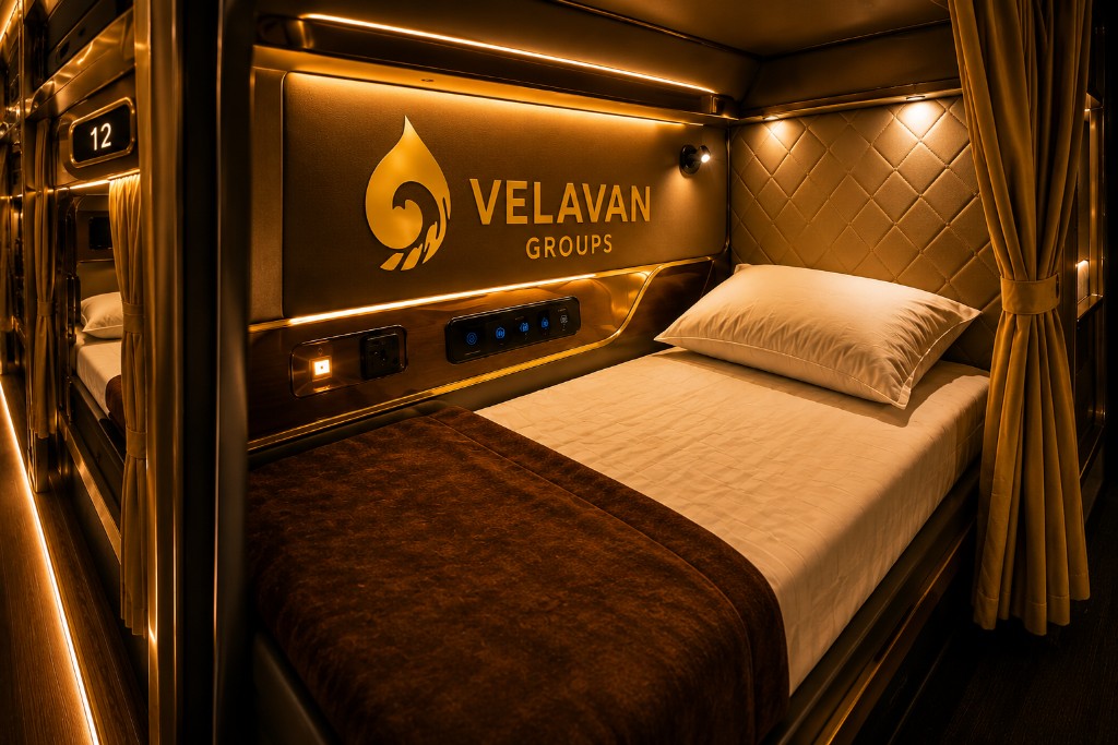 Velavan Groups luxury sleeper bus berth with warm golden lighting