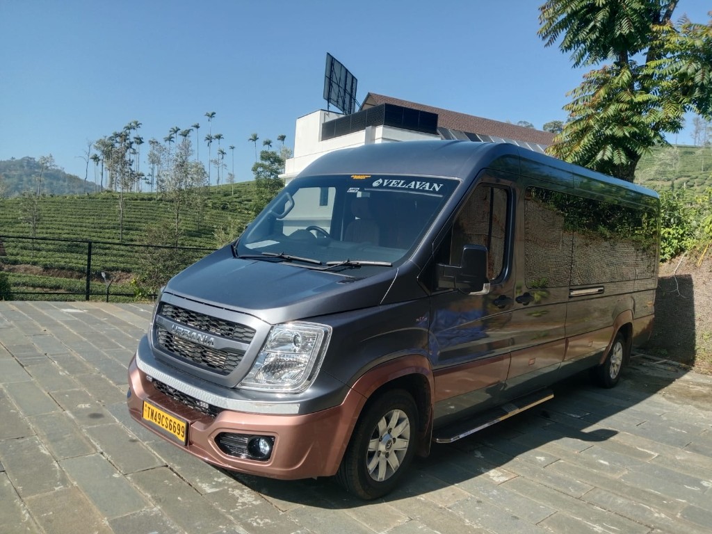 Velavan Urbania van with hillside and tea estate backdrop