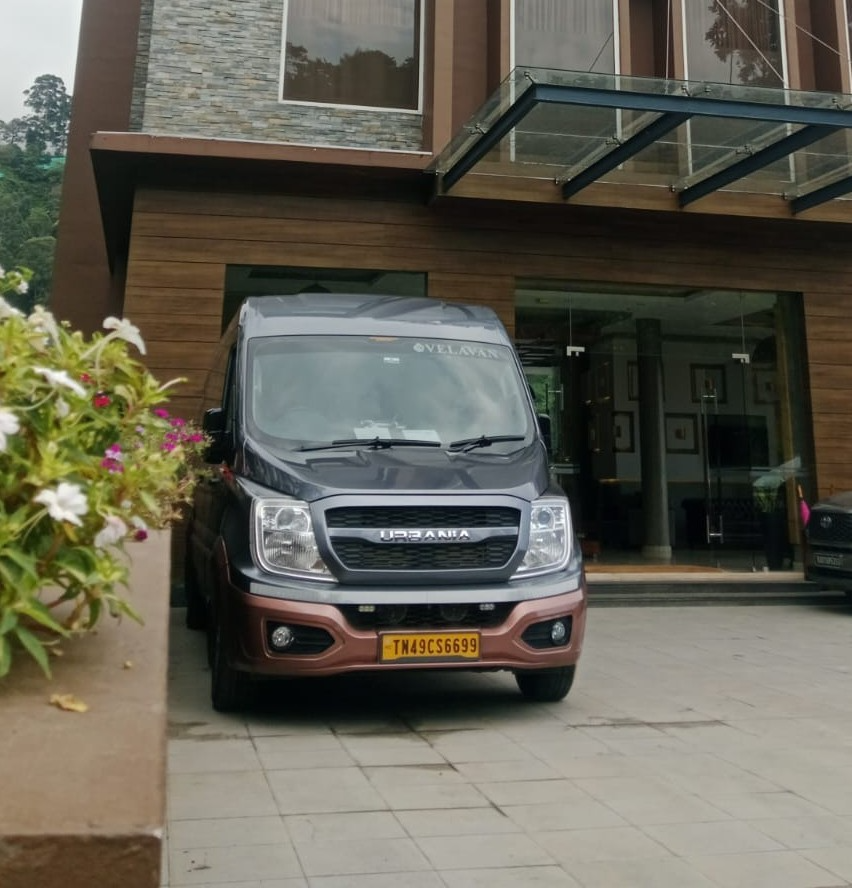 Force Urbania van at luxury resort entrance with hillside view