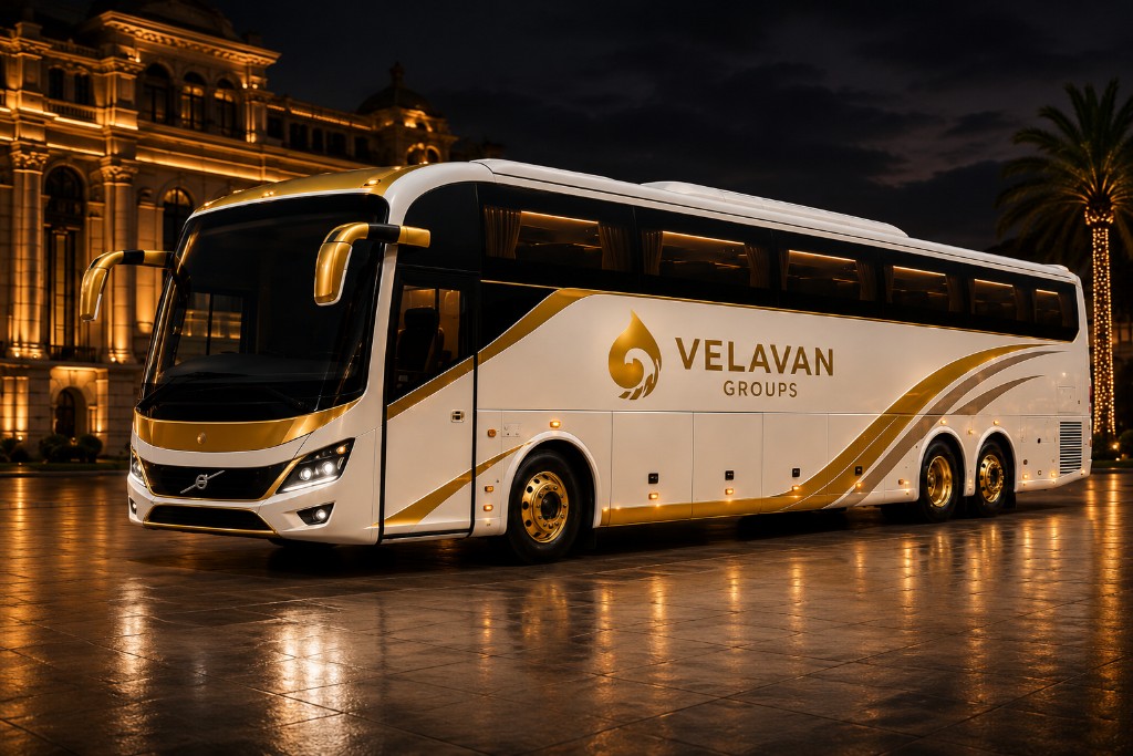 Velavan Groups white and gold luxury coach at night
